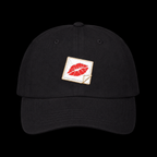 Kiss and Tell Hat — black, front view on a black background